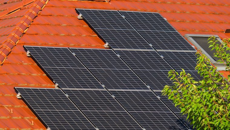 close up of solar panels on a roof of a house