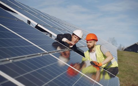 electricians inspecting the solar panels