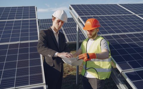 electricians inspecting the solar panels