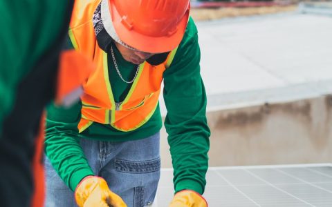 solar technician installing solar panel