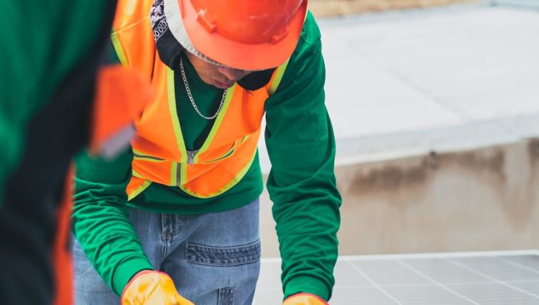 solar technician installing solar panel