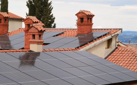 solar panels on tiled roofs in residential area