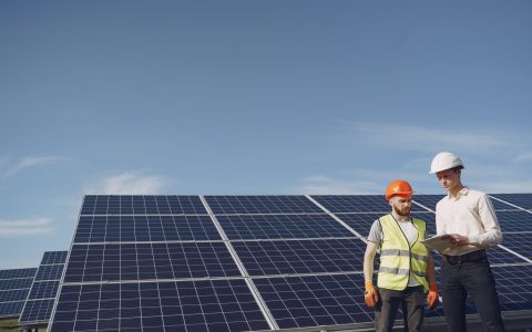 electricians inspecting the solar panels