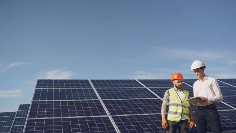 electricians inspecting the solar panels